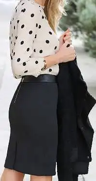 White blouse with medium black polka dots, black knee length skirt